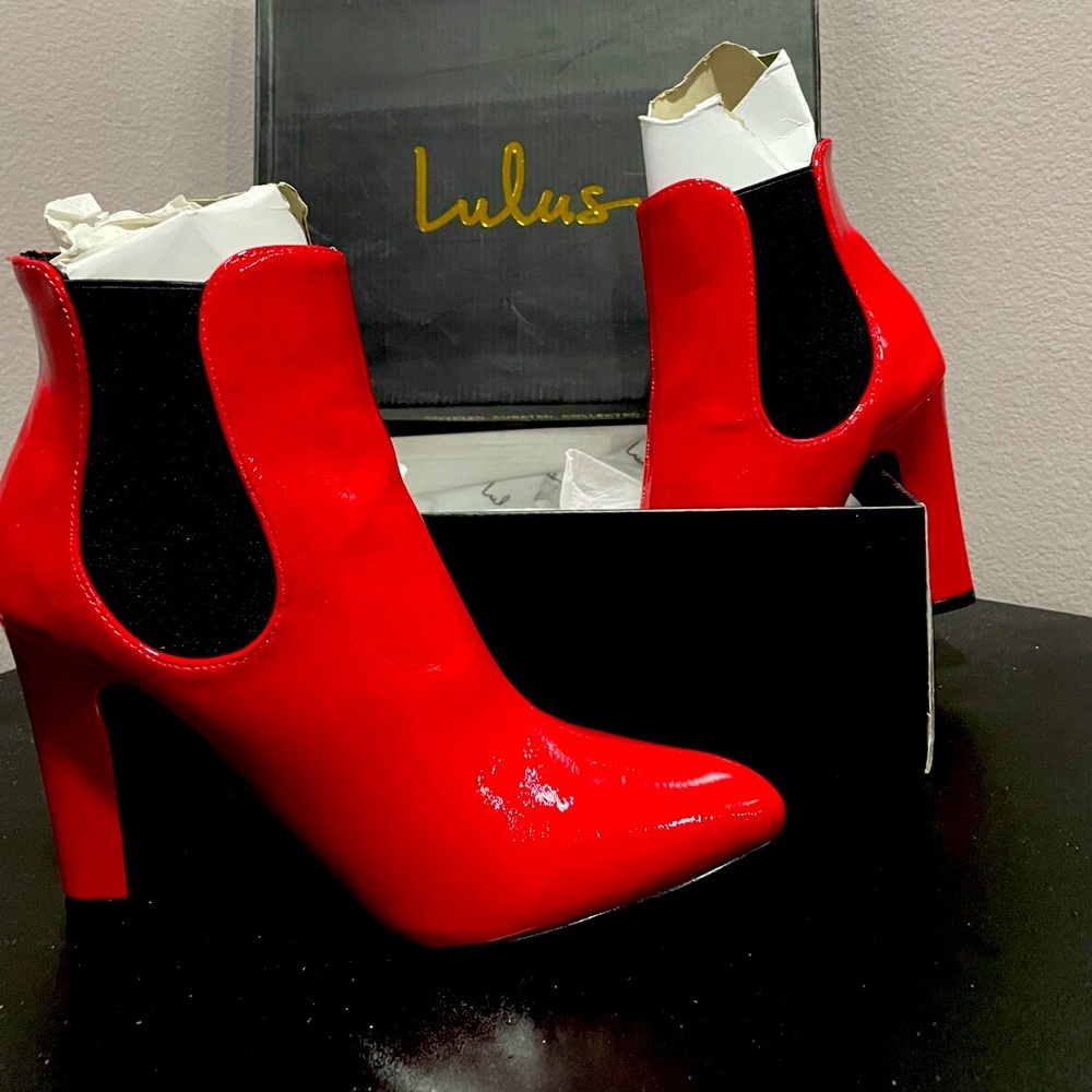 Red Lulu’s boots Brand New never been worn.
